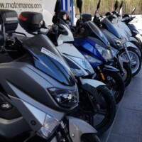 photo of our scooters parked in front of our office in perissa santorini